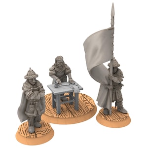 May include: Three unpainted miniature figurines. One figure stands with arms crossed, another works at a small table, and the third holds a large flag. All figures are on circular wooden bases, ideal for tabletop gaming or collecting.