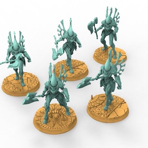 May include: Five teal-colored miniature warrior figurines, each equipped with a large axe and a tall, pointed helmet. The figures stand on circular, textured orange bases that feature intricate, carved patterns resembling cracked earth and ancient symbols.