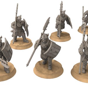 May include: Six miniature figures of warriors, each holding a spear and shield. The figures are painted in a gray color and are standing on circular bases.