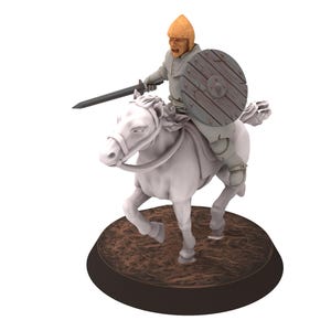 May include: A miniature figurine of a warrior riding a white horse, holding a sword and shield. The warrior is wearing a helmet and armor, and the horse is standing on a brown base.