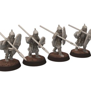 May include: Four miniature figurines of warriors, each holding a spear and shield. The figures are gray and stand on brown circular bases. They are posed as if in battle, with detailed armor and helmets.