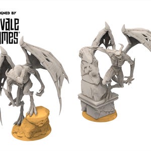 May include: Two grey demon figurines with large, detailed wings. One stands on a rock base, the other is perched on a stone structure. The text "DESIGNED BY DAVALE GAMES" is at the top.