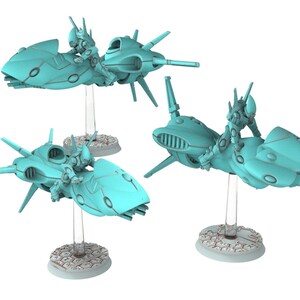 May include: Three turquoise miniature sci-fi jet bikes, each piloted by a sleek armored figure. The vehicles feature elongated, aerodynamic hulls with pointed fins and are mounted on clear vertical stands atop textured hexagonal bases.
