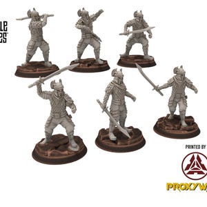May include: Six miniature warrior figurines with swords and helmets, posed on brown circular bases. The figures are in various action stances, with the text "DESIGNED BY DAVALE GAMES" and "PRINTED BY PROXYWARS" visible.
