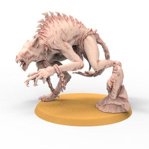 May include: A light pink, monstrous creature figurine with sharp teeth and claws, chained at the wrists. The creature is posed on a yellow circular base. The figurine has a textured, detailed appearance, suggesting a fantasy or horror theme.