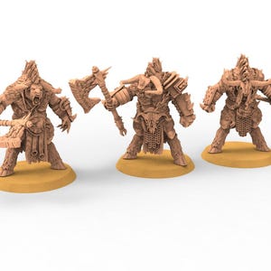 May include: Three beige-colored fantasy miniatures of humanoid creatures with axes. Each figure has a horned helmet, fur-like details, and armor. They stand on circular bases, ready for tabletop gaming or display.
