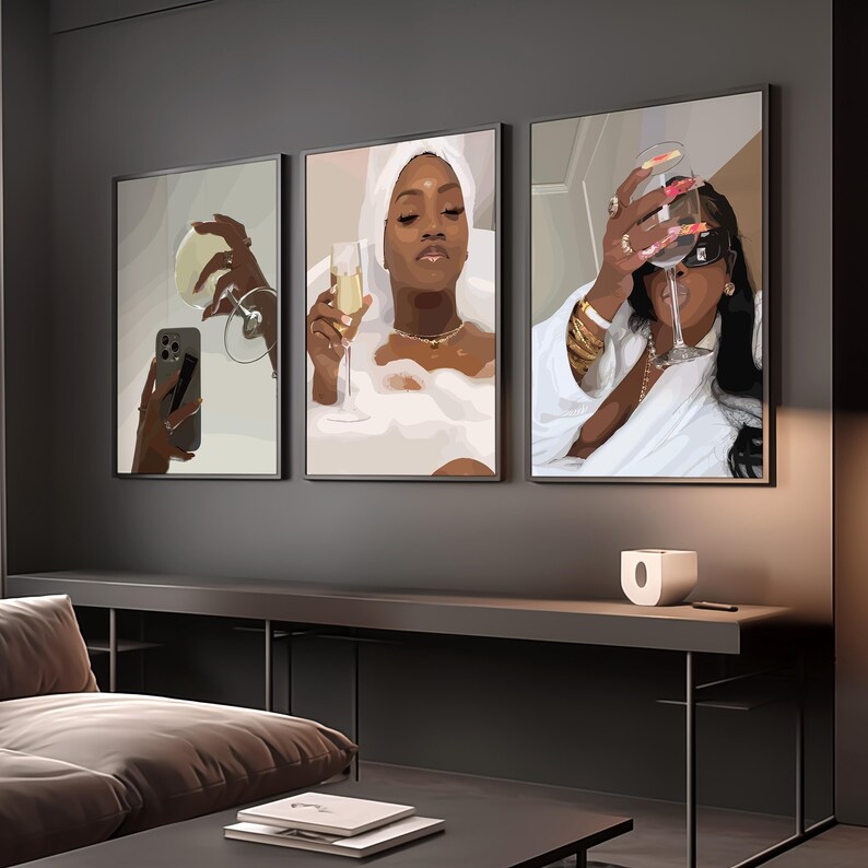 May include: Three framed art prints depicting women enjoying champagne. One print shows a woman taking a selfie with a glass, another shows a woman in a bathtub, and the third shows a woman holding a glass of champagne.