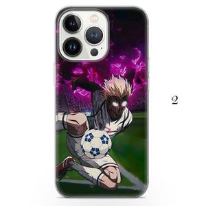 May include: Clear phone case featuring a soccer player with white hair and glowing eyes, kicking a soccer ball on a green field. The background shows a stadium with purple lightning and the number 2.