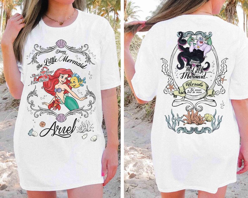 May include: White t-shirt with a front illustration of Ariel from Disney's The Little Mermaid, with the text "Ariel" and "Sparkling Seas Make Waves!". The back features Ursula and the text "Ursula The ocean will be mine."
