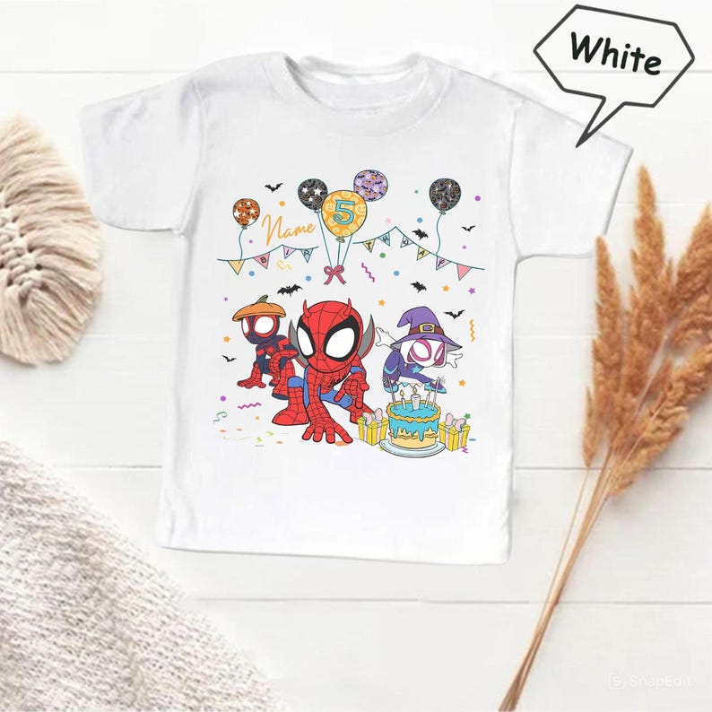 May include: White t-shirt featuring a colorful graphic of Spider-Man characters celebrating a birthday. The design includes balloons, a cake, and the number 5. The word "Name" is also visible.