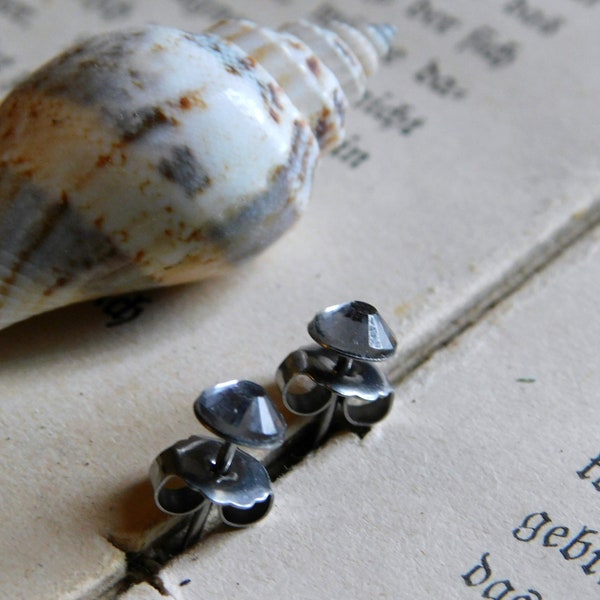 Little Sparklers© . Black Diamond Crystals and titanium post earrings. Darling petite crystal stud earrings. Hypoallergenic. smoky gray