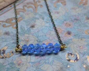Tanzanite Blue Crystal Bar Necklace. Little Sparklers© .  Crystal rondelles & Brass layering minimalist necklace.  #FestiveEtsyFinds