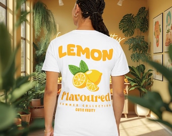 May include: White t-shirt with the word "LEMON" in orange block letters above a graphic of lemons and leaves. Below the graphic, the word "flavoured" is printed in a script font, with "SUMMER COLLECTION" and "CUTIE FRUITY" below.