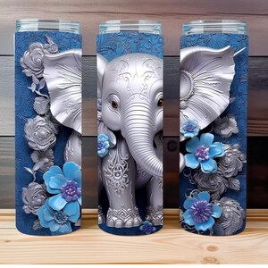 May include: Three silver tumblers with a blue background and a silver elephant with floral accents.