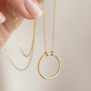 May include: A set of three ceramic mugs with a speckled, matte finish. The mugs are in shades of cream, light gray, and dark gray. Each mug has a simple, minimalist design, perfect for coffee or tea.