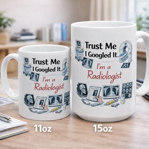 May include: A set of three ceramic mugs with a speckled, matte finish. The mugs are in shades of cream, light gray, and dark gray. Each mug has a simple, minimalist design and a rounded handle. The mugs are likely for coffee or tea.