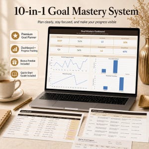 May include: A laptop displaying a Goal Mastery Dashboard with charts and data tables, accompanied by printed Annual Goals and Vision Board documents. The screen shows progress metrics, while the text 10-in-1 Goal Mastery System appears above.