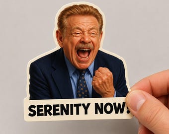 May include: A die-cut sticker featuring a man with a mustache wearing a navy blue suit, light blue shirt, and patterned tie. He has an open-mouthed expression with a raised fist. The text SERENITY NOW! is printed in black at the bottom.