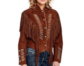 May include: Brown suede jacket with fringe detailing. The jacket features decorative stitching and silver-tone buttons. The sleeves and shoulders have fringe accents, and the jacket is buttoned up the front.