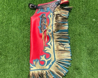 Handgemaakte roodleren rodeochaps met blauwe en gouden franje - Westerncowboy-uitrusting voor stieren