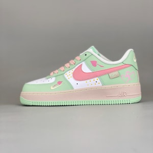 mint green and pink nike shoes