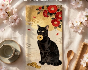 May include: A rectangular hand towel measuring 28 inches by 16 inches featuring a black cat holding a gold coin in its mouth. The design includes red camellia flowers, gold leaf accents, and scattered gold coins on a cream background.