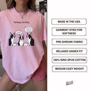 May include: Pink t-shirt with the text "The Boston Tea Party" and a cartoon of three Boston Terriers with teacups. The shirt has a relaxed unisex fit and is made of 100% ring-spun cotton.