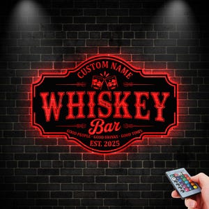 May include: A red neon sign for a Whiskey Bar, mounted on a dark brick wall. The sign features the words "Whiskey Bar" in a bold font, with the option to add a custom name. The sign also includes the text "Good People, Good Drinks, Good Times, Est. 2025."