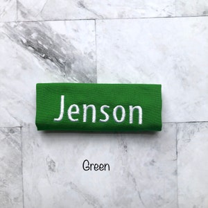 Personalized green handle wrap, with white embroidery your choice of name or monogram. Our handle wraps measure  4.5 inches by 5.25 inches and are 100% cotton with a strip of Velcro to attach securely around any handle.