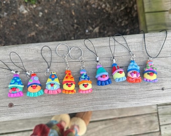 Handmade polymer clay clown heads, keychains, phone straps, and pendants