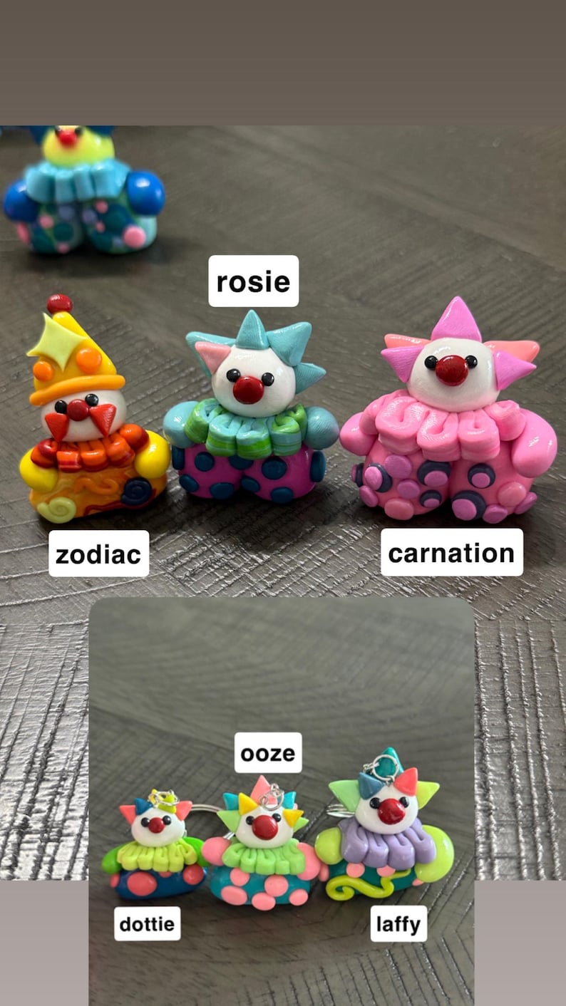 May include: A collection of six small, colourful clown figurines crafted from clay. Each figure features a unique colour scheme, including zodiac, rosie, carnation, dottie, ooze, and laffy, with distinct hats, ruffled collars, and polka-dot patterned trousers.