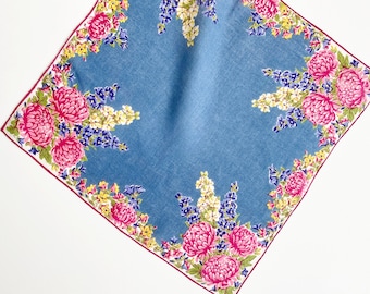 Vintage pink and blue floral handkerchief  w/ rolled hem. A large 14 X 14" collectible hanky with pink mums & hollyhocks on chambray blue.