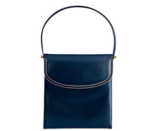 Vintage black leather top handle purse. Dressy gold trimmed handbag with flap and snap closure. 1970s Unmarked Coblentz pocketbook