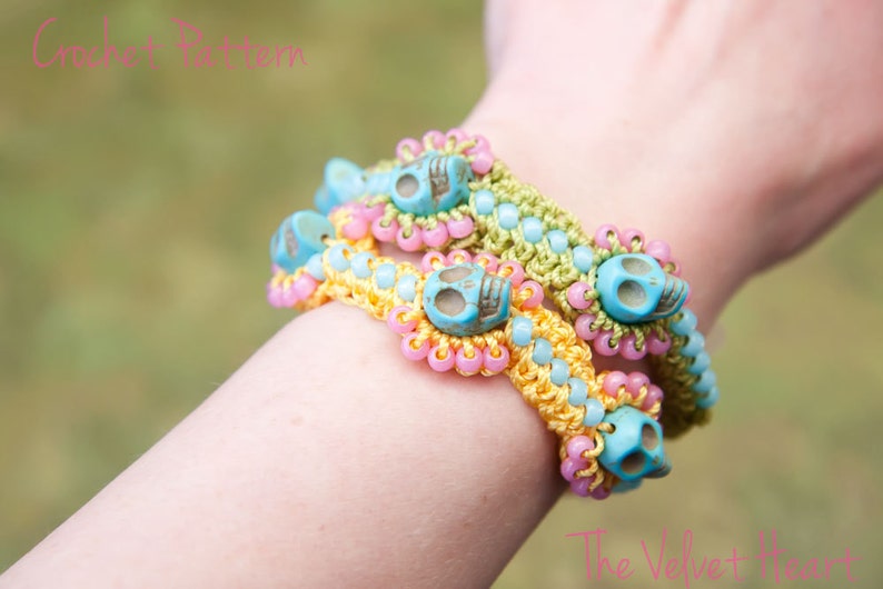 May include: Three crocheted bracelets with turquoise skull beads. The bracelets are in shades of pink, yellow, and green.