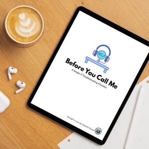 May include: A white tablet with a black border displaying a checklist titled "Before You Call Me: A Simple IT Troubleshooting Checklist". The checklist features a cartoon illustration of a blue headset with a speech bubble that says "HELP". The tablet is on a wooden surface with a cup of coffee, a white case, and two white earbuds.