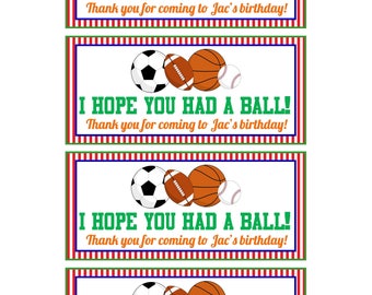 May include: Four favor tags with a red and blue striped background. The tags feature a soccer ball, football, basketball, and baseball. The text on the tags reads "I hope you had a ball! Thank you for coming to Jac's birthday!"