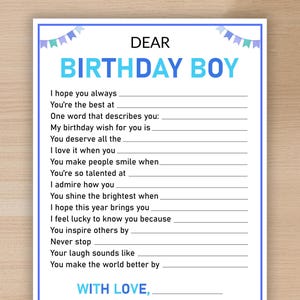 May include: A fill-in-the-blank birthday card with a blue border and text that reads "DEAR BIRTHDAY BOY." The card has spaces for personalized messages and is decorated with blue and teal banner graphics.