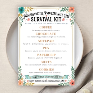 May include: A decorative card with the text "Administrative Professionals Day Survival Kit" in a floral design. The card lists essentials like coffee, chocolate, notepad, pen, paperclip, mints, and cookies. The card is on a white plate.