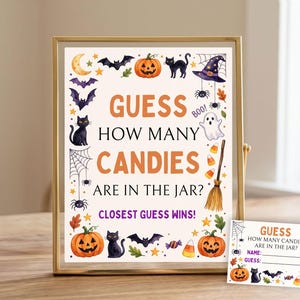 May include: A Halloween-themed sign in a gold frame and a matching small card. The sign reads GUESS HOW MANY CANDIES ARE IN THE JAR? CLOSEST GUESS WINS! It features illustrations of pumpkins, black cats, bats, a ghost, a witch hat, and candy corn.
