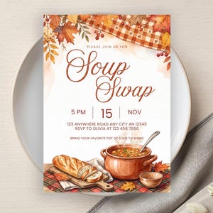 May include: A rectangular invitation card for a Soup Swap event featuring watercolor illustrations of autumn leaves, a checkered cloth, a pot of soup with a ladle, a loaf of bread on a wooden board, and text including 5 PM, 15 NOV, and address details.