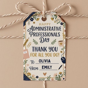 May include: A gift tag with the message "Happy Administrative Professionals Day, Thank You For All You Do!" The tag is decorated with floral and office-themed illustrations. The tag is tied to a wrapped gift with twine.