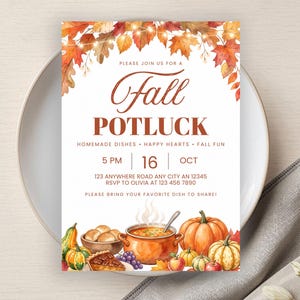 May include: A rectangular invitation card for a Fall Potluck featuring watercolor autumn leaves and string lights at the top. The text reads: Please join us for a Fall Potluck, Homemade dishes, Happy hearts, Fall fun, 5 PM, 16 Oct, 123 Anywhere Road, RSVP to Olivia at 123 456 7890, Please bring your favorite dish to share. The bottom displays pumpkins, a pot of soup, and a pie.