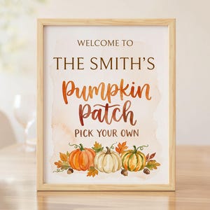 May include: A framed sign with a light wood border featuring the text WELCOME TO THE SMITH'S Pumpkin Patch PICK YOUR OWN in brown and orange lettering. The design includes a watercolour illustration of three pumpkins and autumn leaves.