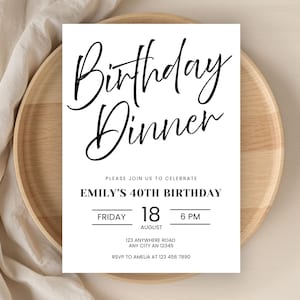 May include: A white invitation card with black script that reads "Birthday Dinner." The card includes details for Emily's 40th birthday, including the date, time, and location. The card is on a wooden plate.