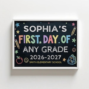 May include: A rectangular sign in a white frame featuring a black chalkboard background with colorful text reading SOPHIA'S FIRST DAY OF ANY GRADE 2026-2027 SMITH ELEMENTARY SCHOOL, decorated with chalk-style drawings of stars, pencils, an apple, and a backpack.