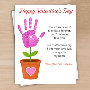 May include: A Valentine's Day card with a handprint flower design. The flower is a pink handprint with a green stem and leaves, planted in an orange pot with a pink heart. Text reads "Happy Valentine's Day."