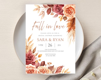 May include: A bridal shower invitation with the text "Fall in love" and floral watercolor accents in shades of burgundy, peach, and brown. The invitation includes details for Sara & Ryan's shower, including the date, time, and location.