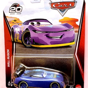 May include: A Disney Pixar Cars Will Rusch die-cast toy car in purple and blue with yellow accents, packaged in a blister card featuring the character illustration, the 20th anniversary logo, and the Mattel logo. The car has a rear spoiler.