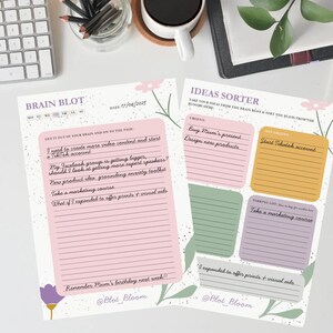 Może przedstawiać: Dwa notatniki, Brain Blot i Ideas Sorter, z odręcznymi notatkami. Notatnik Brain Blot ma różową sekcję z liniami i tekstem "I need to create more video content and start a TikTok account".