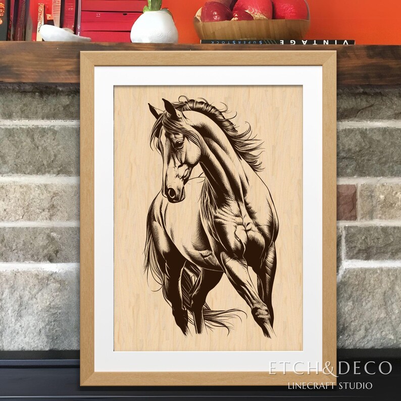 May include: A framed artwork featuring a detailed line drawing of a horse in motion. The horse is depicted in shades of brown against a light wood-grain background. The artwork is encased in a light brown wooden frame with a white mat.